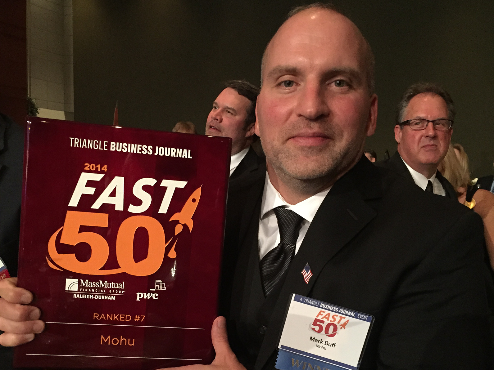 Mohu CEO Mark Buff holding his Triangle Business Journal Fast 50 Award