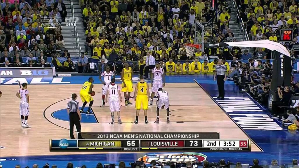 NCAA image of a Michigain Louisville basketball game